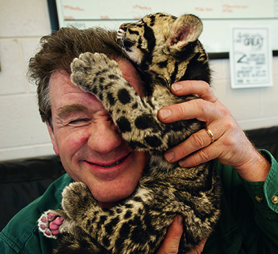 Joel Sartore with clouded leopard cub