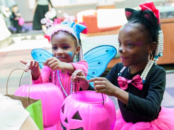 Halloween trick-or-treat girls, half header