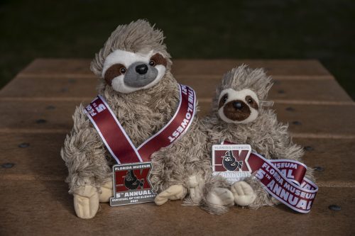 sloth doll with medals