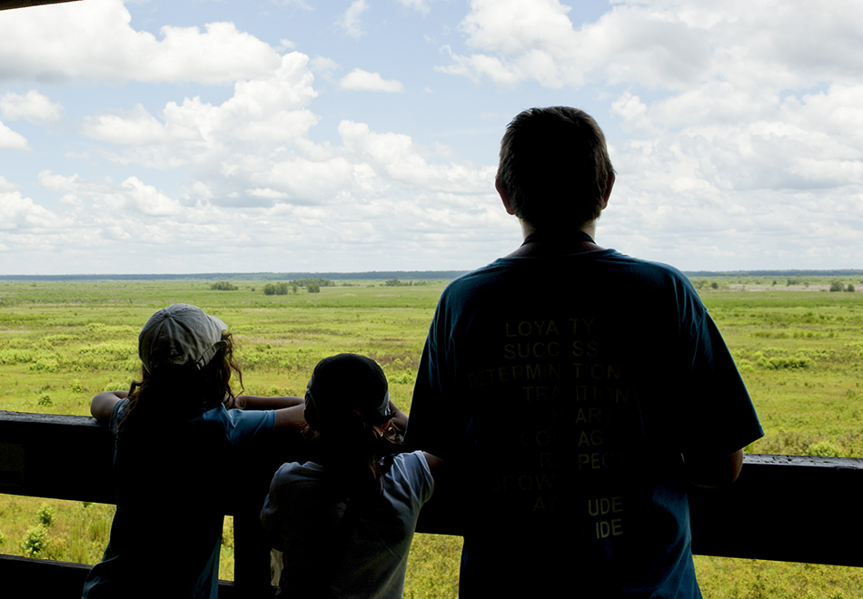 people standing at lookout