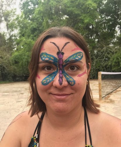 person with face paint smiling