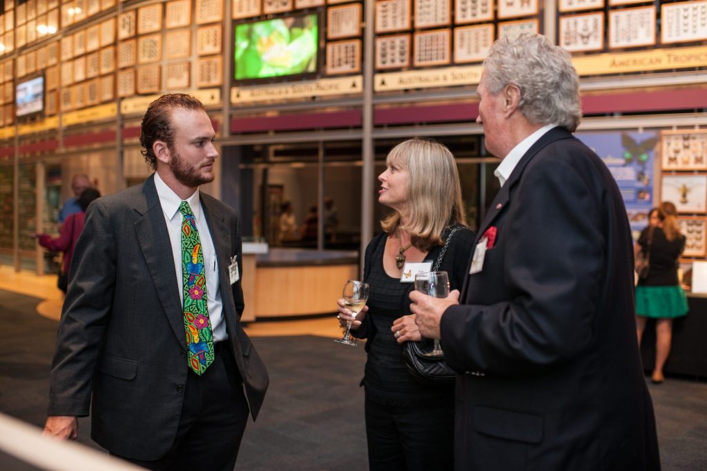 visitors talking to a researcher