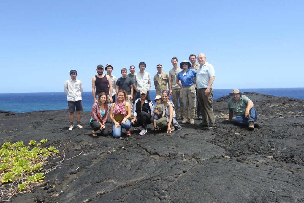 group photo on a rocky outcrop near the ocean