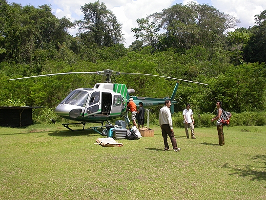 scientists preparing to board a helicopter