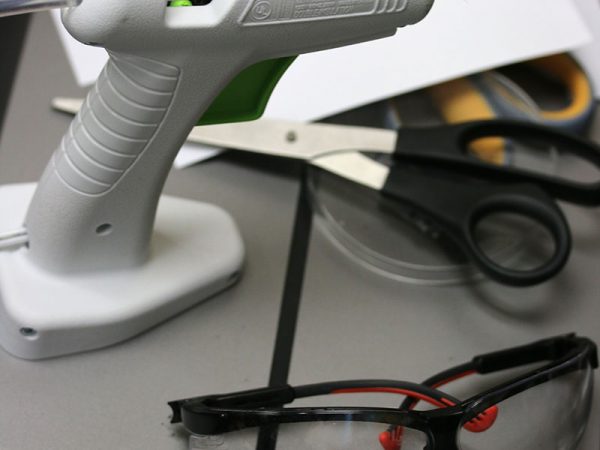 hot glue gun and safety goggles