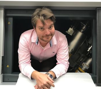 person surrounded by lab equipment