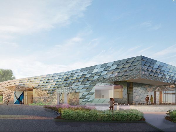 an illustration of the front of a long low public building is very rectangular with metallic panels somewhat like fish scales
