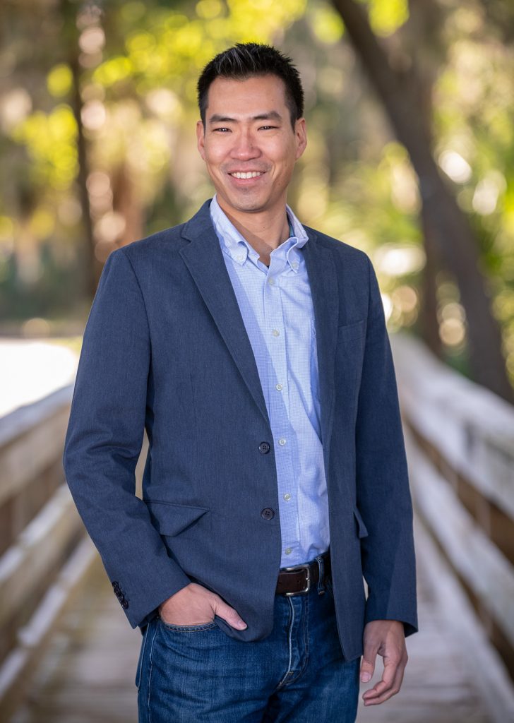 portait of Akito Kawahara standing on a boardwalk outside