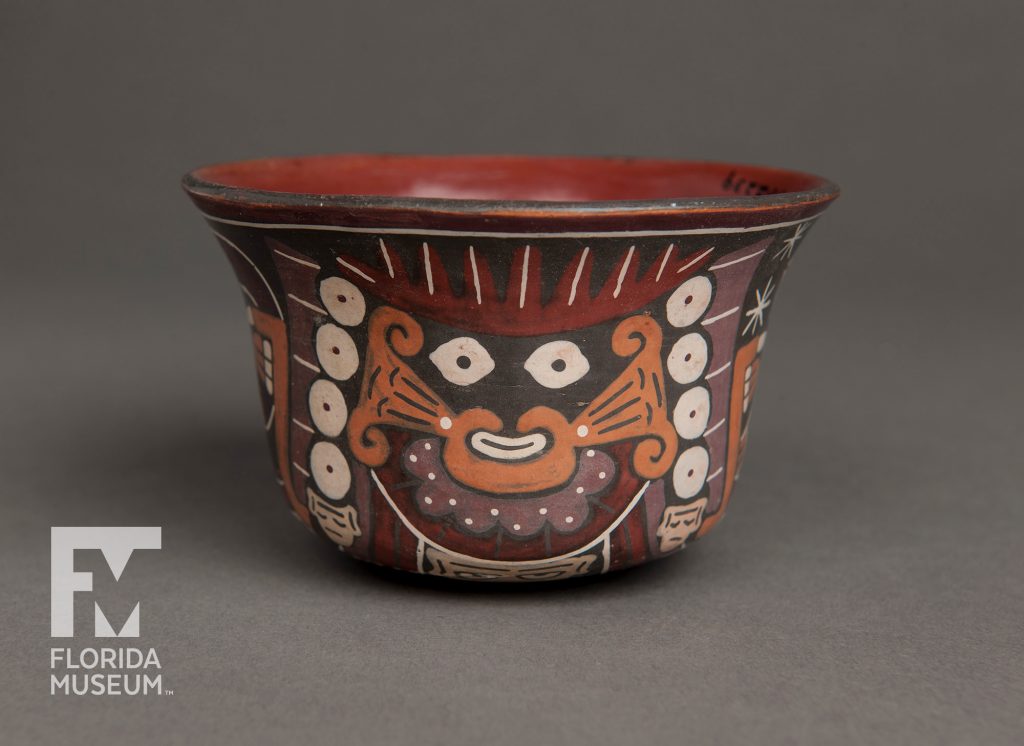 bowl painted with figure in black, orange, purple and red