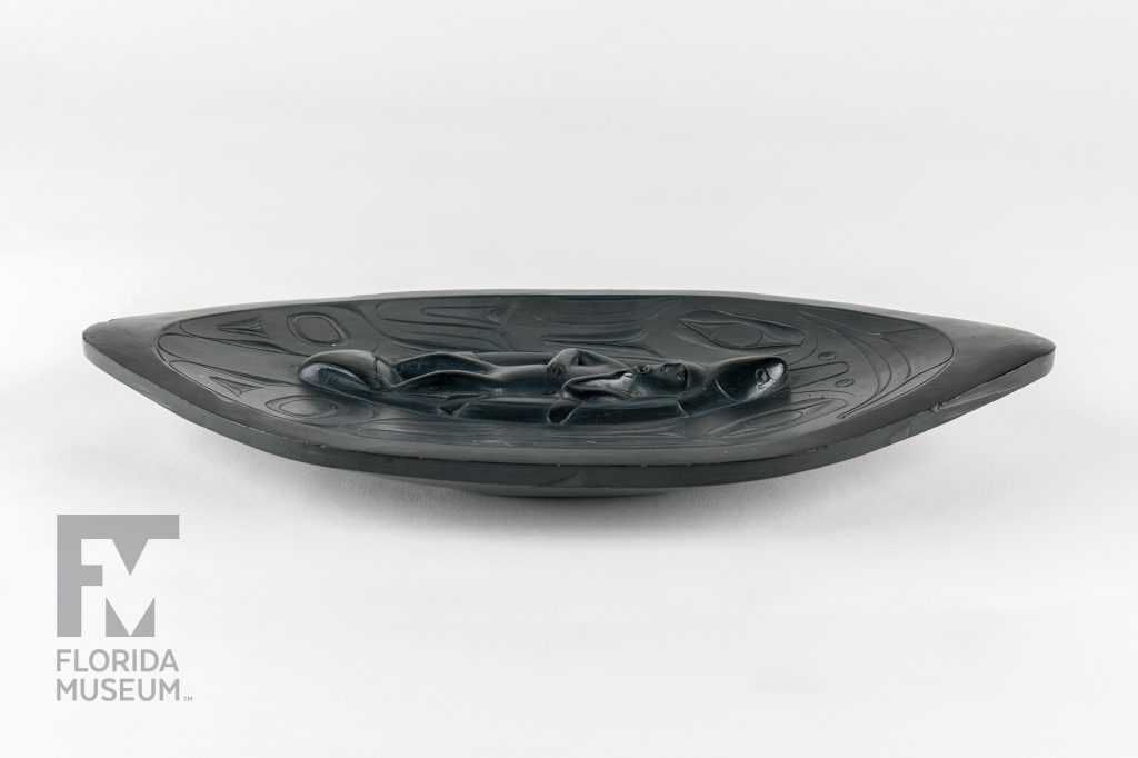 carved platter photographed from the side to show the raised carving