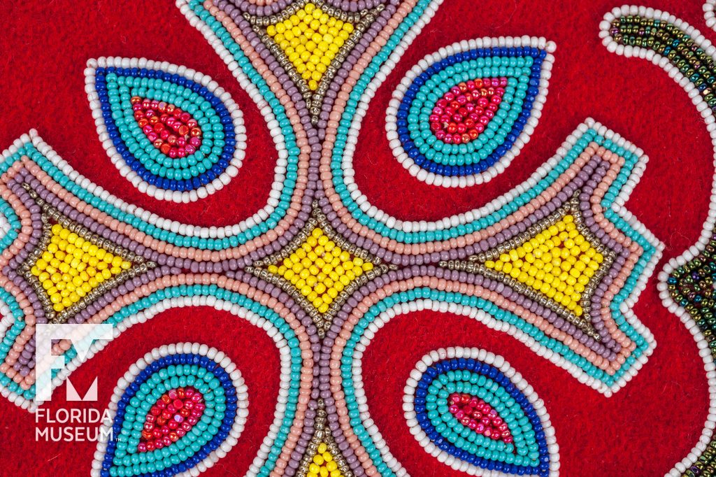 close up of a design sewn from multi-colored seed beads