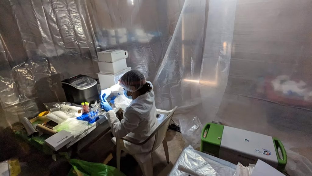 person in a protective gear working in lab