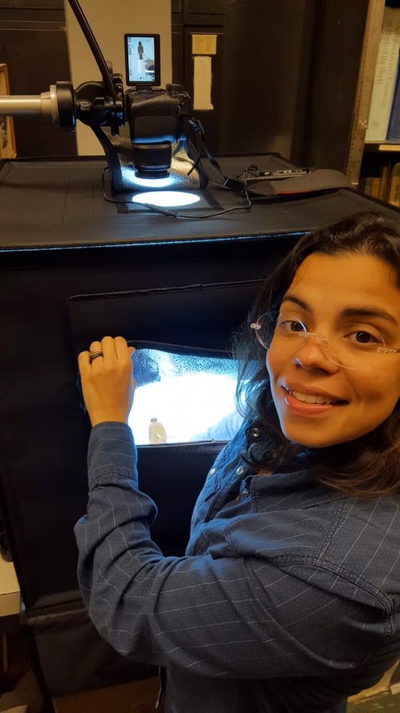 Researcher photographing specimens