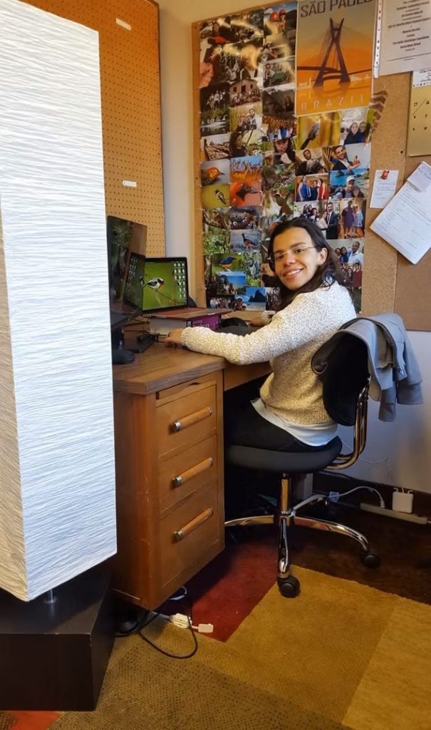 researcher working on a computer at a desk
