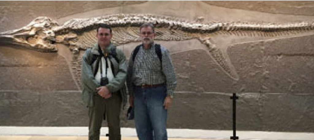 Professor Bocherens and author at the Haupt Museum, with a large ichthyosaur in the background.