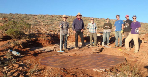 Ross with students standing over a rock they were able to move with his help. Photo courtesy of Mary Droser