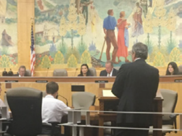 Dr. Luis Chiappe (Vice president of Research and Collections at the Natural History Museum of Los Angeles County & Director of the Dinosaur Institute), Karol McQueary (President of the Southern California Paleontological Society), and 6th grade student Llandyn Lubs and family with Assembly member Richard Bloom