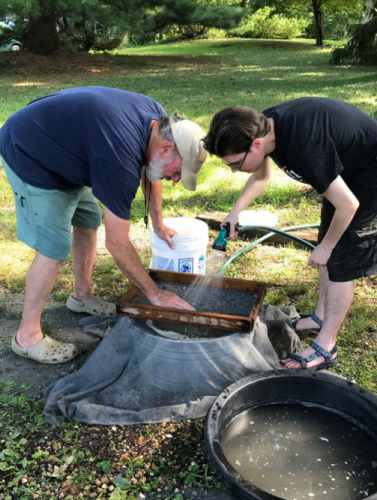David and his son Alex wet screening matrix from the recent Belgrade dig. Photo courtesy of Paula Bohaska