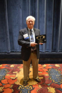 Figure 1: Jack with Strimple Award at thePaleontological Society Banquet.