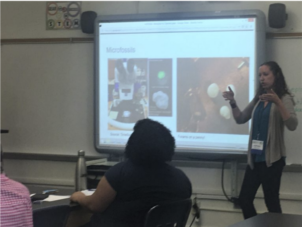 Adriane discussing how planktic foraminifera are used to tell time in the sedimentary record at the educators workshop.