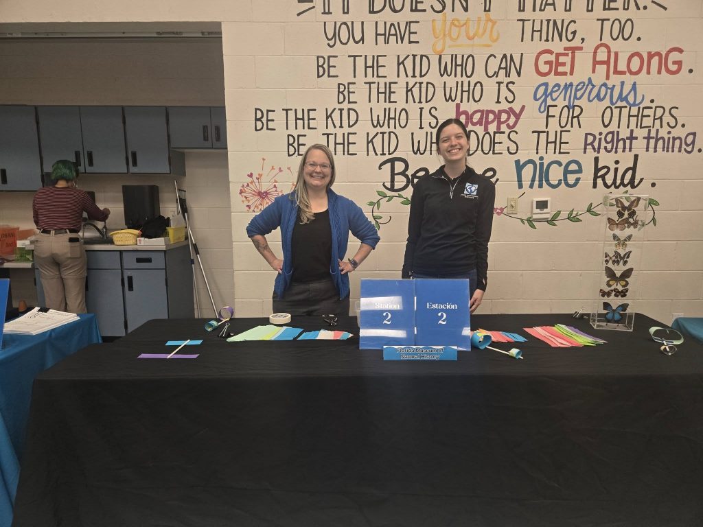 table set with Station 2 sign and items for hoop glider activity
