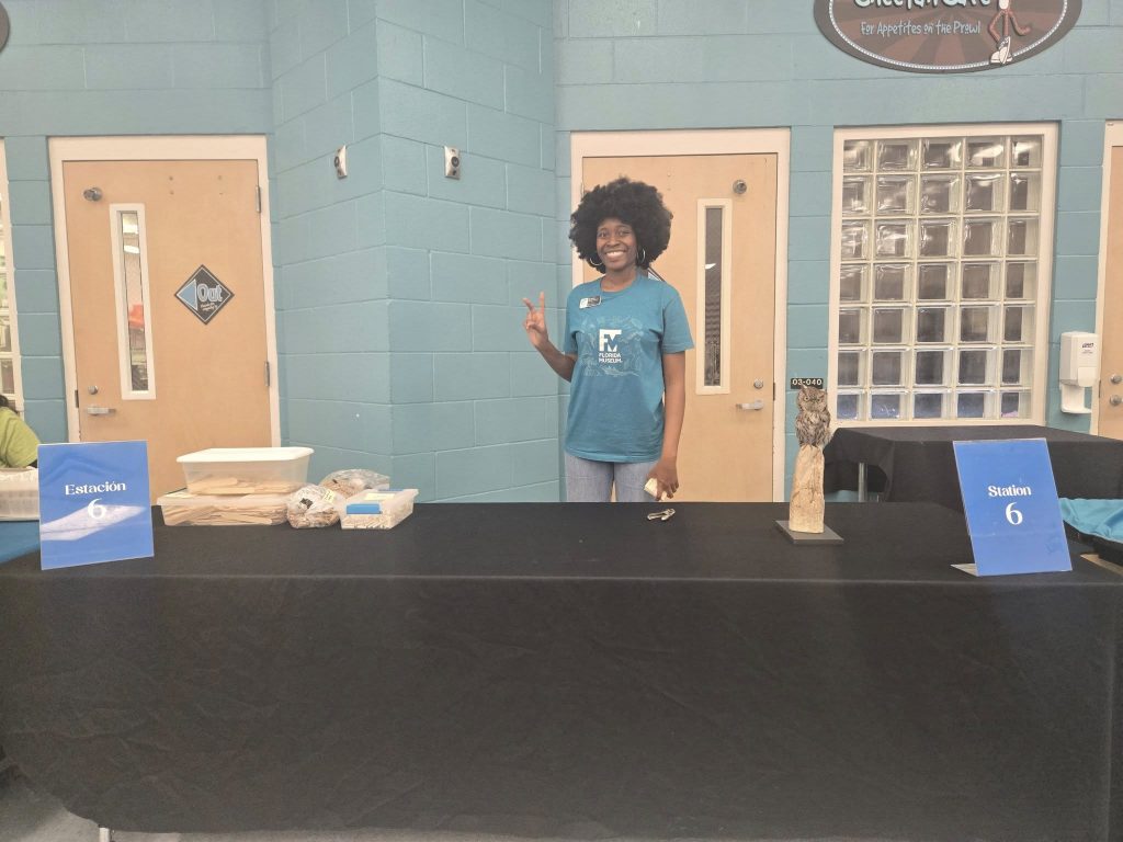 Education team member the behind station 6 table