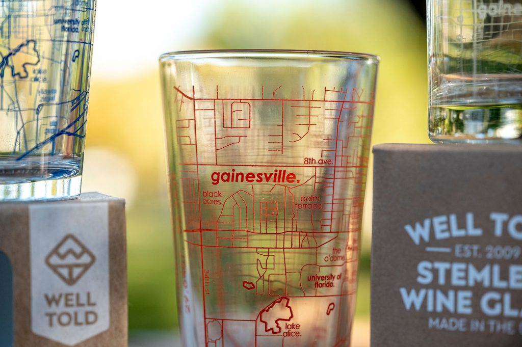 Pint glass with an orange map of Gainesville, FL.
