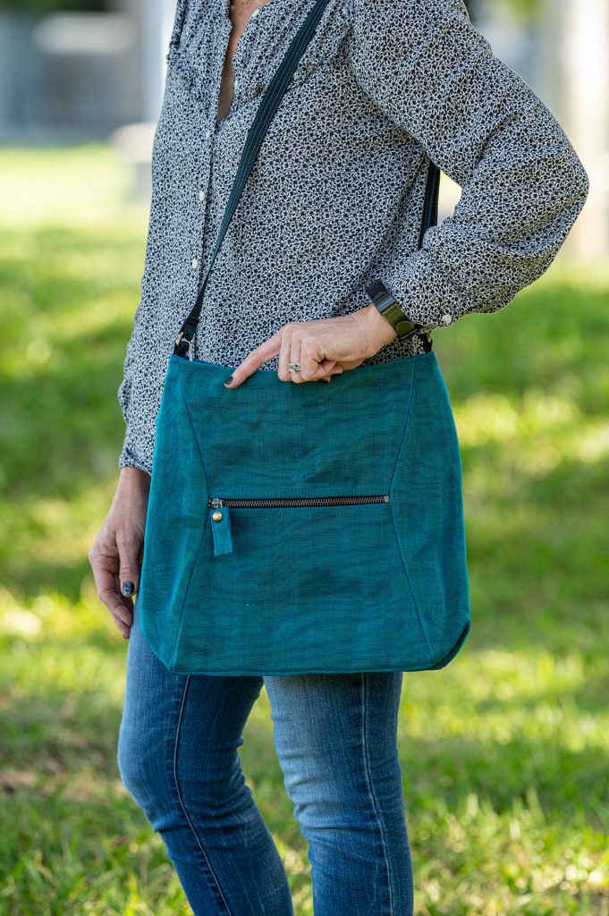 large blue/teal shoulder bag made from vegan fabric