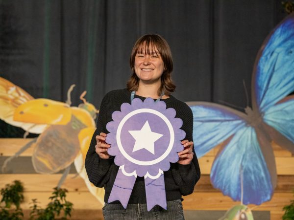 Skyla Sheehy on stage at ESA receiving an award