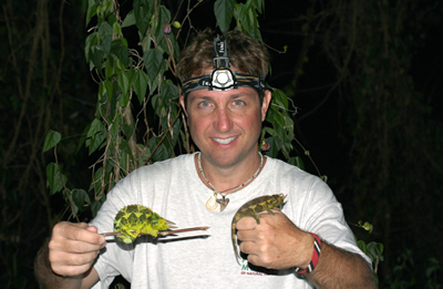 Kenny Kryston holds chameleons