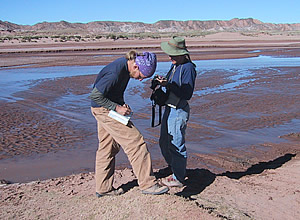 students crossing river