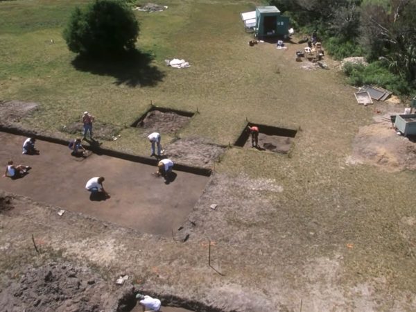 aerial view of a field with several excavation pits