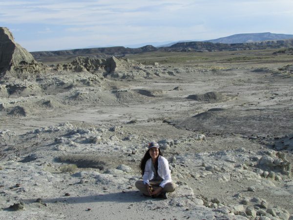 Arianna sitting in the badlands