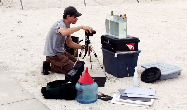 Zachary photographing fish