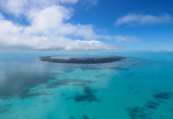 Atoll surrounded by turquoise water