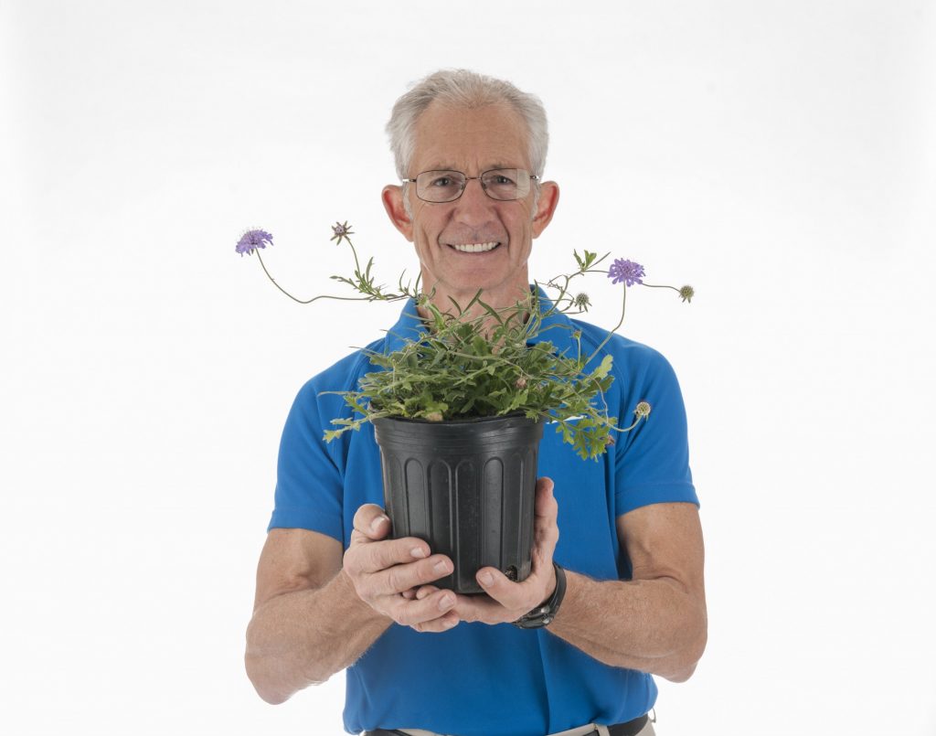 Doug Soltis holding potted plant