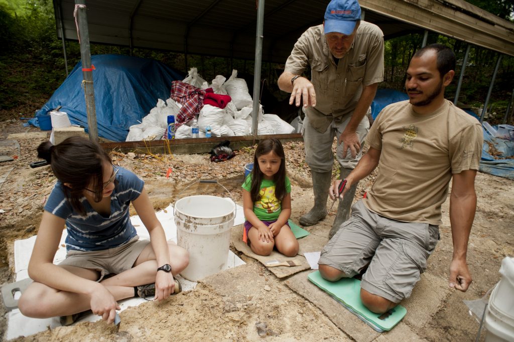 people at a fossil dig site