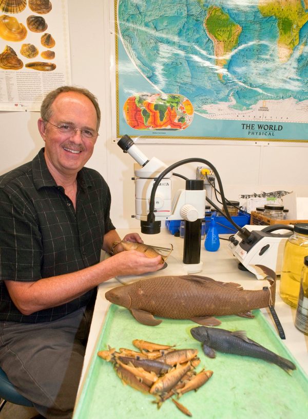 researcher holding specimens