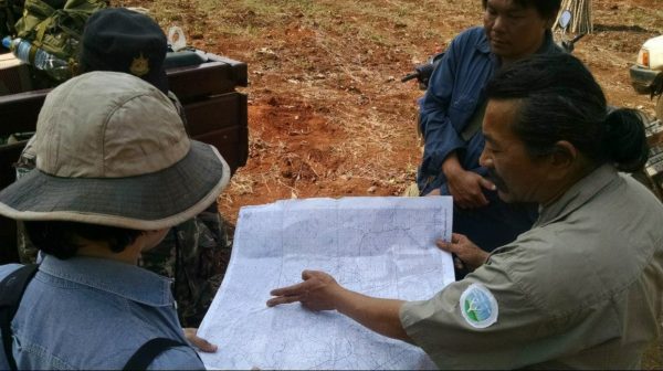 man pointing to map