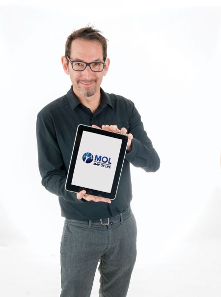 A scientist holding a tablet