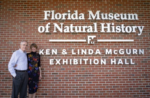 Ken and Linda McGurn in front of building