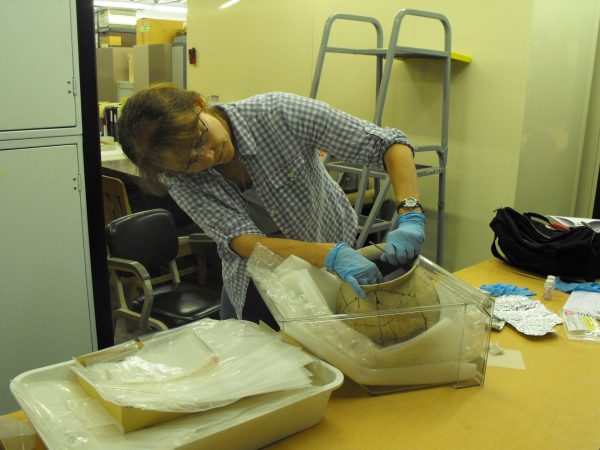 person examining pot