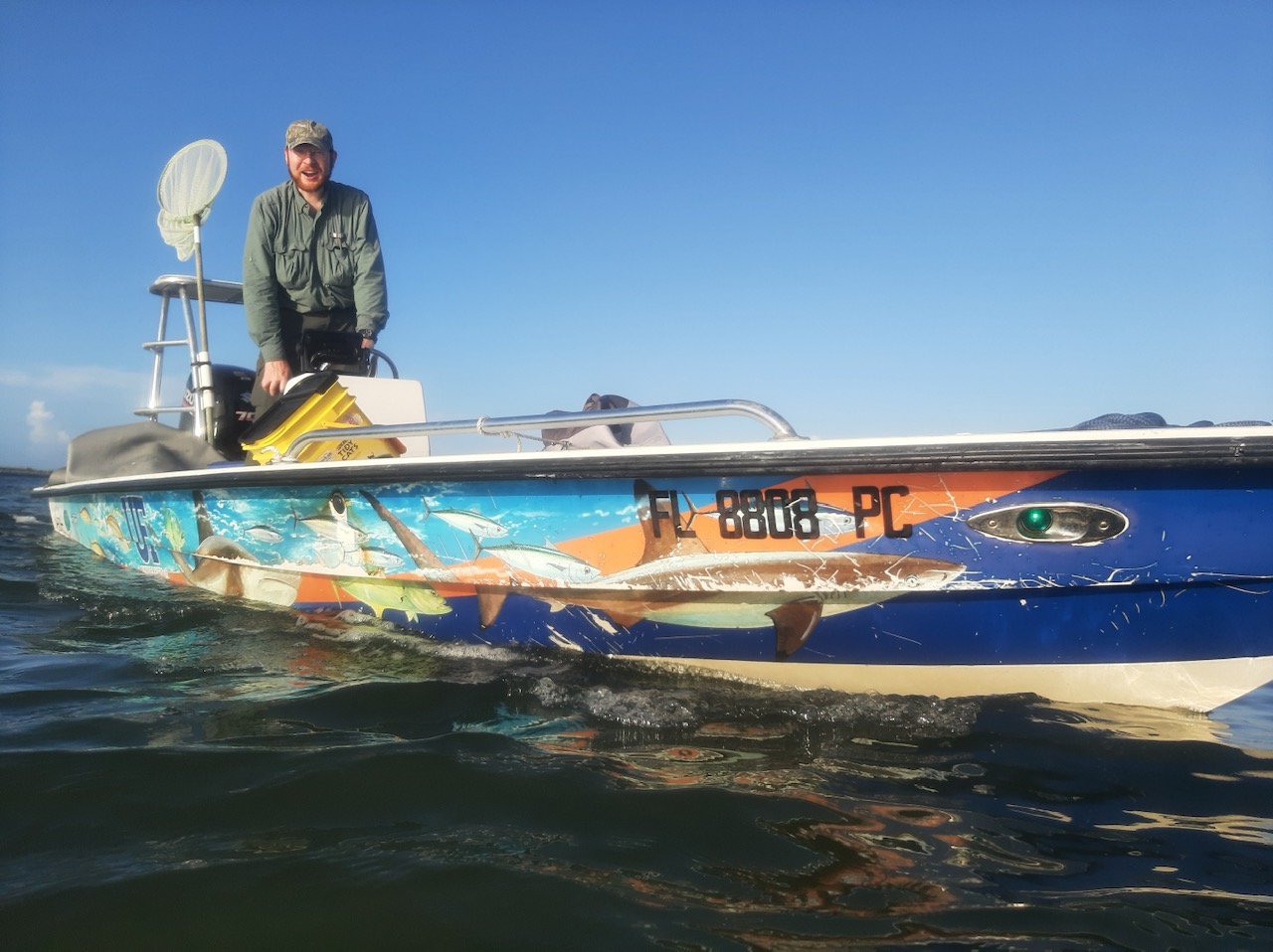 Tyler Bowling pilots a small boat through the inlet at New Smyrna Beach