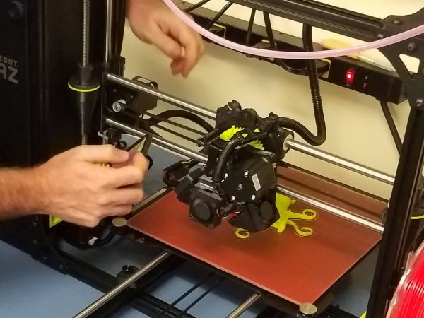 technician setting up 3D printer