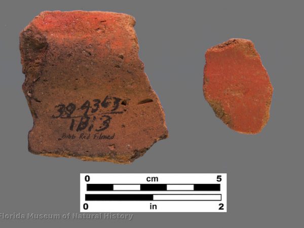 2 sherds with bright red filming