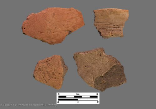 4 sherds of pottery with rough exteriors