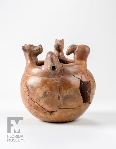 Close up of pottery with animal heads