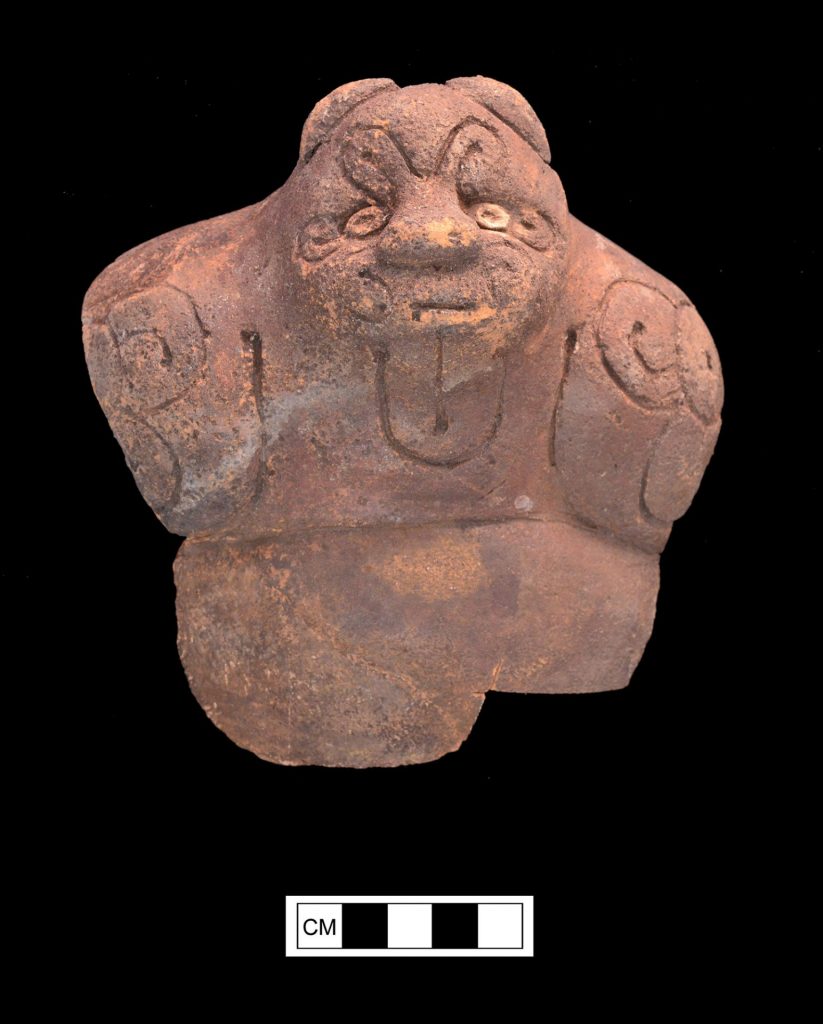 small bear-like ceramic head from museum collection