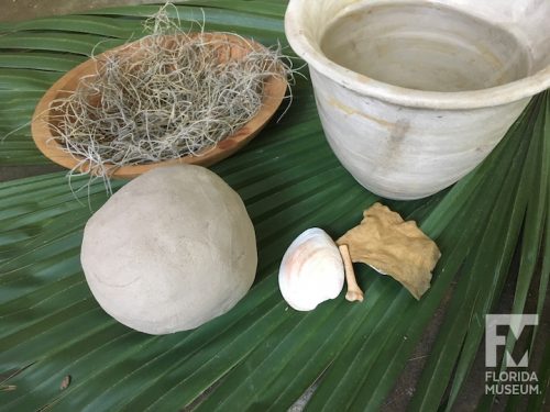 Ball of clay and tools on a palmetto frond