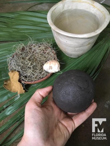 Ball of black clay and pottery tools